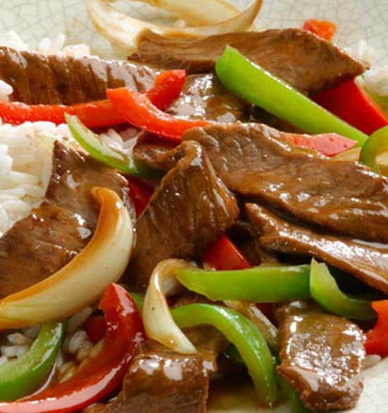 This Ginger Pepper Steak recipe will transport your taste buds to Asia with it's quick-cooking steak and bell peppers in a flavorful ginger sauce.