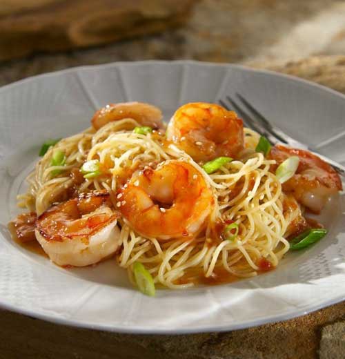 In little more than the time it takes to boil water you have got dinner on the table with this quick-to-fix Chili Garlic Shrimp with Sesame Noodles.