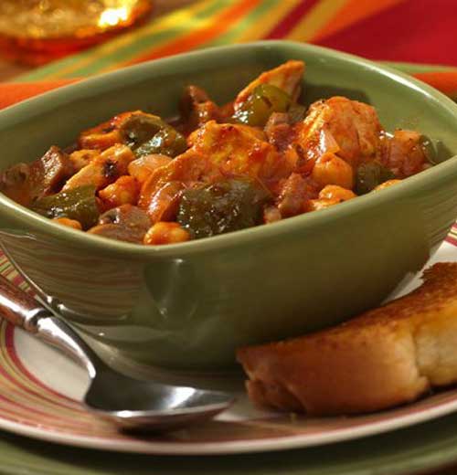 Dig into a simple dish of chicken slow-cooked with bell peppers, convenient canned mushrooms, and hearty garbanzo beans.