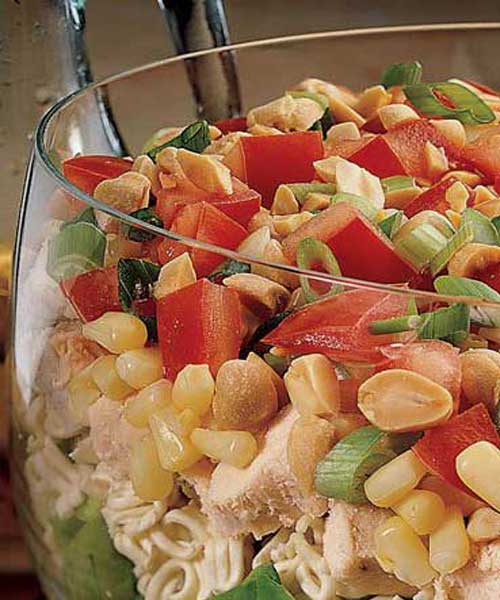 Just 15 minutes is needed to layer ingredients that toss into a delicious chicken salad with a gingery dressing.