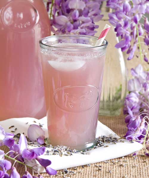 Recipe for Lavender Lemonade - Adding lavender gives your lemonade a beautiful pink colour without all the added food coloring and preservatives found in the store bought variety. It also adds a delicious floral flavor that perfectly complements spring. Enjoy!