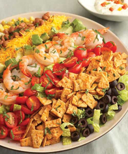 Colorful and flavorful ingredients are easily arranged to make this Rainbow Mexican Salad. It makes a beautiful presentation and is ready in just 30 minutes.