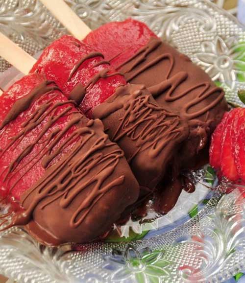 What is there not to like – luscious sweet strawberries, mashed up, and frozen on a stick. Then dip them chocolate! – Oh my children of all ages (and adults) will love these!
