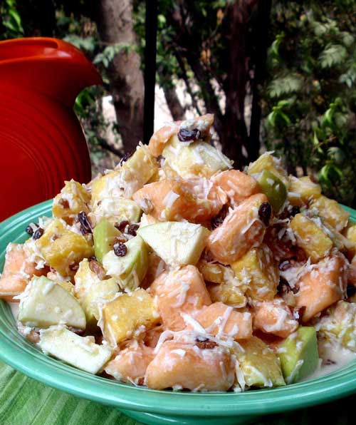Recipe for Cantaloupe Fruit Salad - This is the ideal summer salad to accompany whatever you're grilling. It's healthful, cool and pretty. And don't think that added sugar will improve the taste. The natural sugars in the fruit combine perfectly with the tartness of the yogurt for a delicious, refreshing side dish.