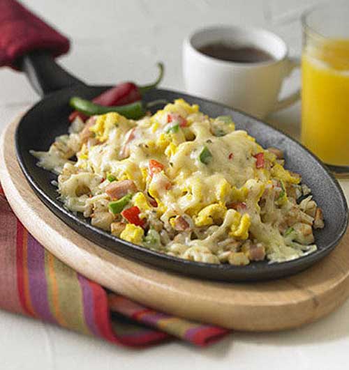 Recipe for Cheesy Cowboy Breakfast Skillet - Very good for breakfast or dinner, I’m sure they’ll be lining up for seconds.