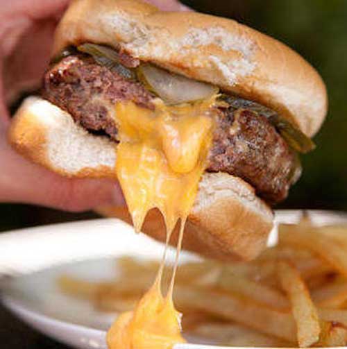 Recipe for Juicy Lucy Burger - These cheese-stuffed burgers ooze cheesy goodness with every bite—and now you can make your own at home. Be sure to aim any cheese drips over your French Fries.