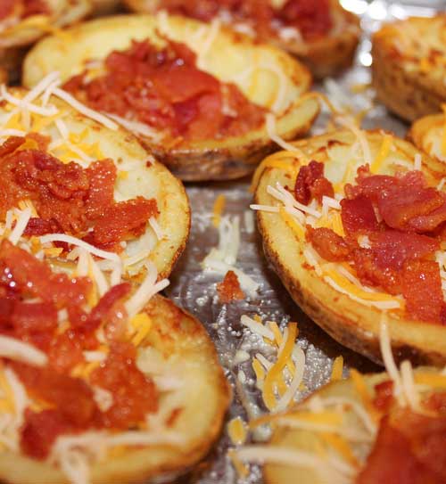 Recipe for Restaurant Style Potato Skins - Crispy bacon, ooey, gooey cheese and crispy yet soft potatoes combine to make the most awesome of appetizers!