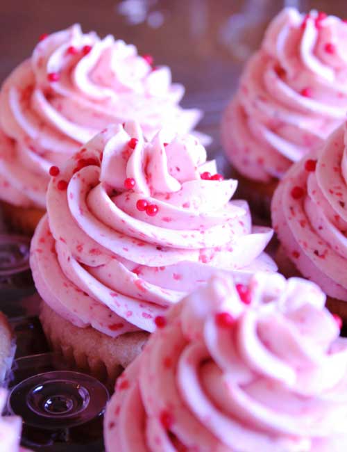 Recipe for Strawberry Cupcakes with Strawberry Swiss Meringue Buttercream - Now the cake is great but the frosting, well that is another story entirely, in fact it really deserves its own post! It is one of the best frosting’s I have ever had and its pink, what could be better than that!
