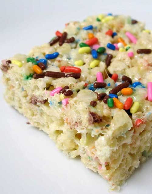 This Cake Batter Rice Krispie Treats recipe brings back a favorite sticky childhood treat, combined with the fun of licking the cake batter spoon.