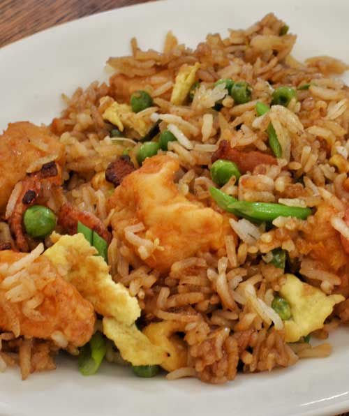 Spicy and sweet Orange Chicken with Fried Rice. You may never order take-out again after trying this recipe!