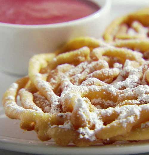 Recipe for Funnel Cakes with Strawberry Sauce - These are so easy to make and everyone will love you for the nice surprise at your next get together or just a fun dessert to cheer up the kids!