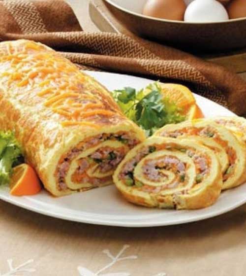 This brunch dish has wonderful ingredients and an impressive look all rolled into one! I love hosting brunch…and this special omelet roll is one of my very favorite items to prepare and share.