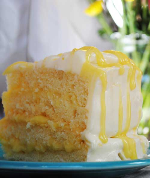 This Lemon Pucker Cake is a moist, buttery lemon cake filled with tangy lemon curd and encased in the perfect sweetness of a decadent white chocolate buttercream.