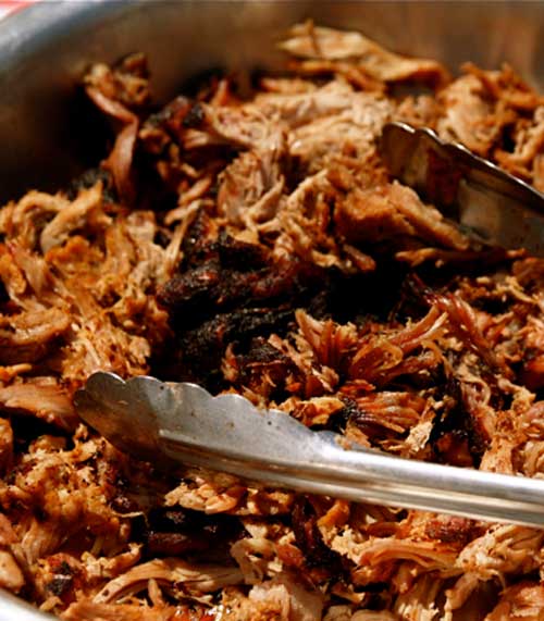 Skip the drive-thru and make a batch of these super simple Easy Crock Pot Pulled Pork Barbecue Sandwiches for an easy dinner.