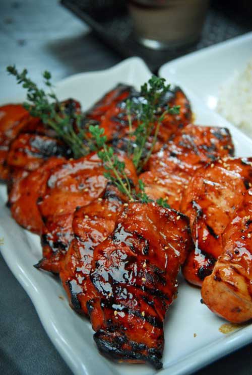 You are sure to surrender to the sweet aroma of this Asian Barbeque Chicken being cooked in an open fire.