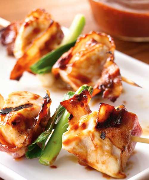 Here is a super simple recipe that helps you to turn four everyday ingredients into an extraordinary appetizer. These Grilled Bacon Chicken Skewers are a must try at any barbecue.