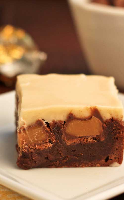 These Double Caramel Brownies start with a simple, one bowl brownie recipe…then after they are baked, chocolate covered caramels are pressed into the hot brownies. Cream cheese icing infused with caramel completes this dessert.