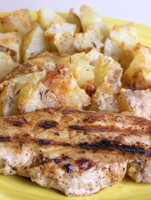 Pork and potatoes is such a classic combination. And with this pair of recipes for Grilled Lemon Herb Pork Chops with Parmesan Roasted Potatoes, you will find out why, in such a yummy way.