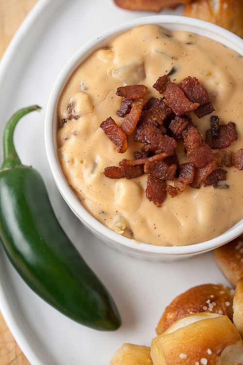 There are hot dips…and then there's this Jalapeno Bacon Queso Dip. With chopped bacon and a kick of garlic...it's a keeper!