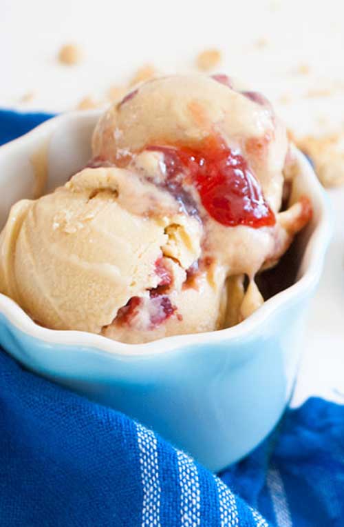 PB&J isn't just for kiddie sandwiches any more care of this Peanut Butter and Jelly Ice Cream recipe. I like to include fresh strawberries in the jam for that fresh-y burst.