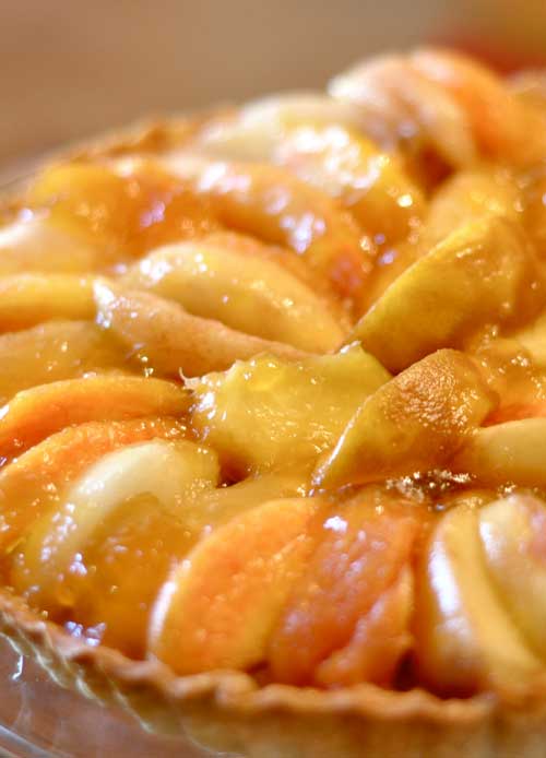 I picked up a small basket of peaches on Saturday and let them get just ripe enough to bake with.  So, today was the day and Peach Tart is what's for dessert!