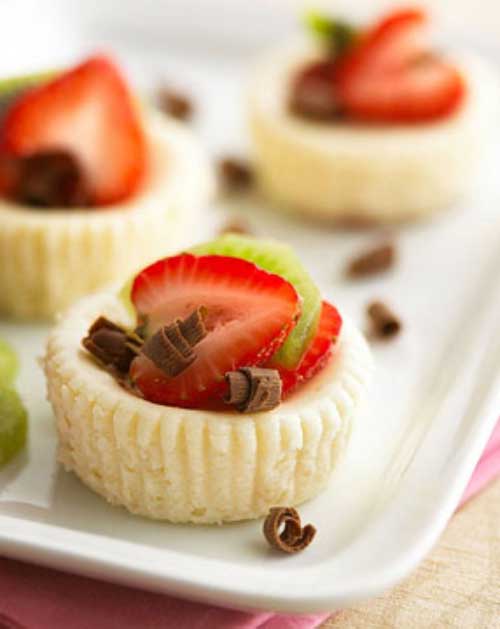 Recipe for Low-Cal White Chocolate Mini Cheesecakes - We gave this recipe for mini cheesecakes a healthy makeover to make these creamy, dreamy morsels guilt-free. Enjoy!