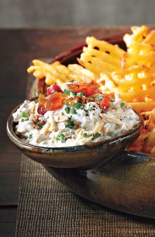 Use extra-crispy waffle fries as dippers in this delicious Loaded Baked Potato Dip and don’t forget the crumbled bacon and hot sauce!