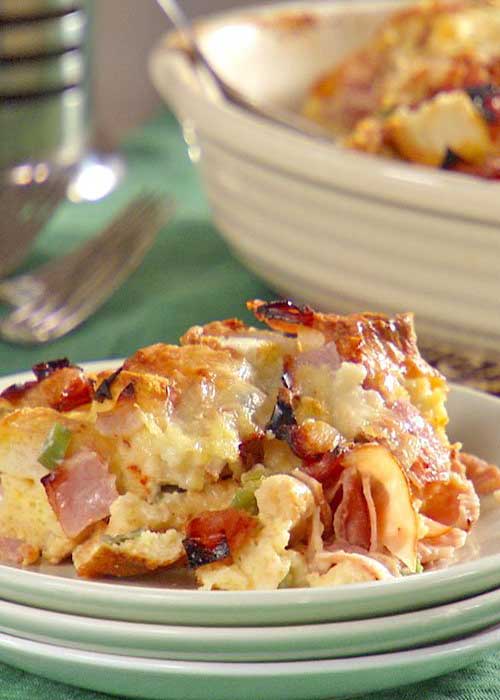 Recipe for Ham and Cheese Strata - This hearty make-ahead breakfast is infused with Dijon mustard and bakes up to a fluffy, golden finish.