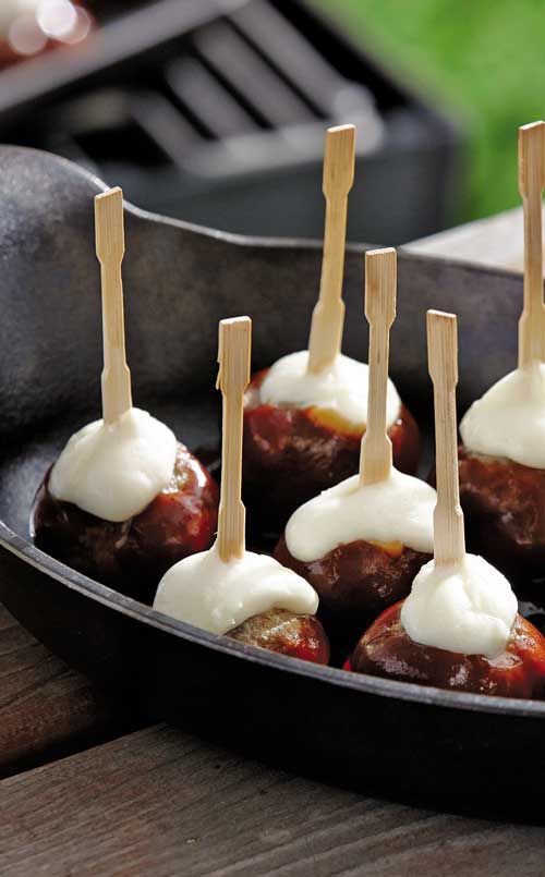 This recipe for deliciously gooey grilled meatball skewers is a tasty way to kick the party off right.