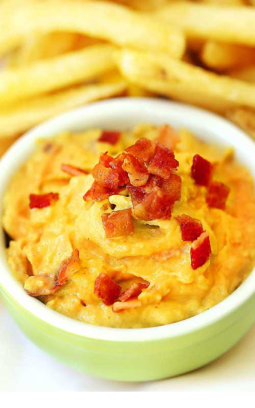 Your game-day guests will love dipping vegetables, chips, fries or wings in this Sriracha Bacon Avocado Dip or use it as a delicious spicy spread on sandwiches.