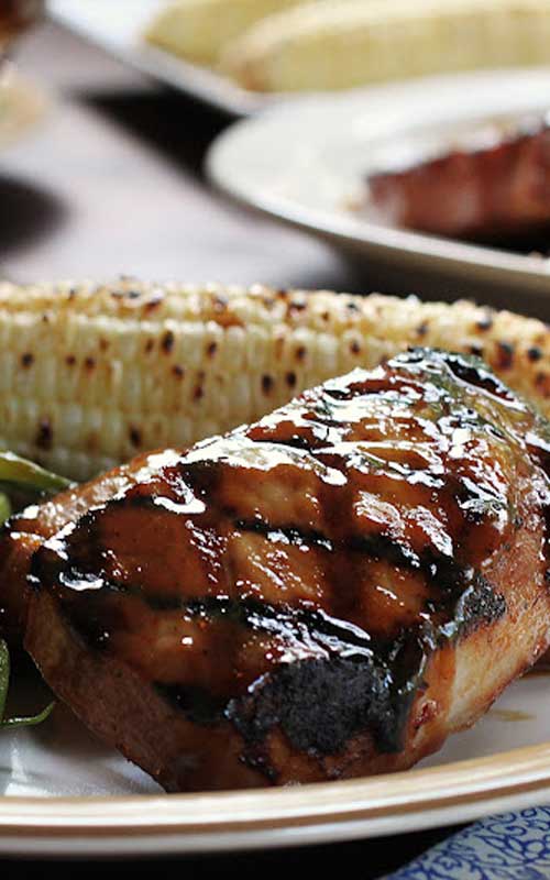 Pork chops drowned in a boozy sauce, these Bourbon Glazed Pork Chops are so good you will want to lick the plate!