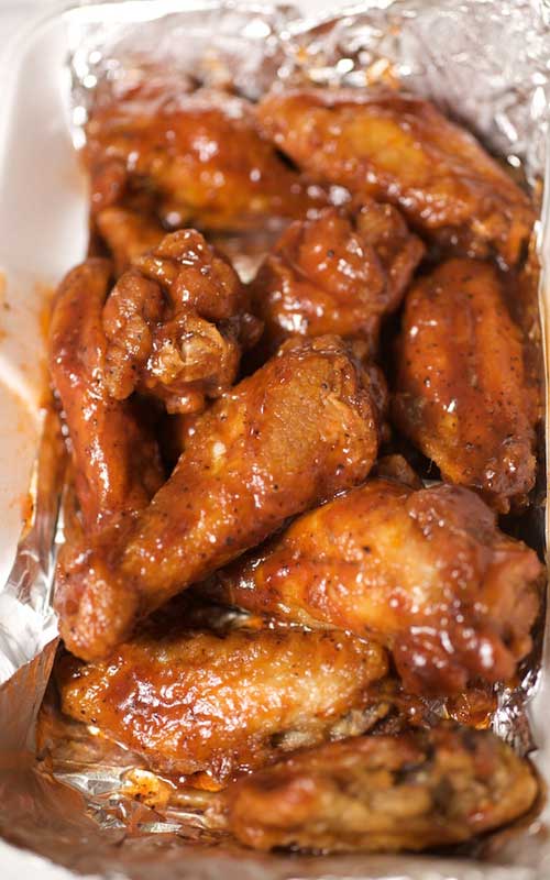 Wings are easy to make at home, and baking them in the oven cuts down on the fat and grease. Impress your friends with our Lightened-up Sweet and Spicy Chicken Wings