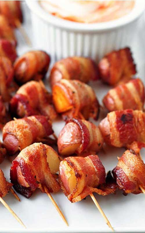 The perfect party food...Bacon Wrapped Rosemary Potatoes! This is my goto recipe for any party, and they ALWAYS disappear!