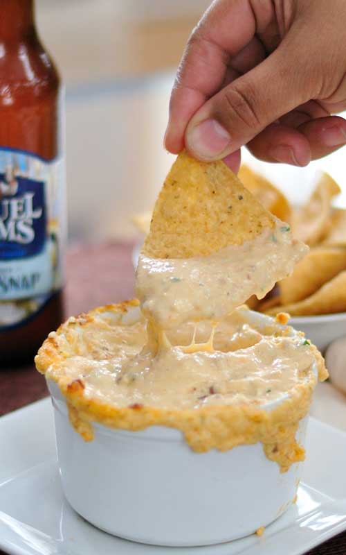 This Warm Cheese & Beer Dip is one of those creamy, gooey dips that you casually taste, and then find yourself scarfing down half the bowl before you fully come to your senses!