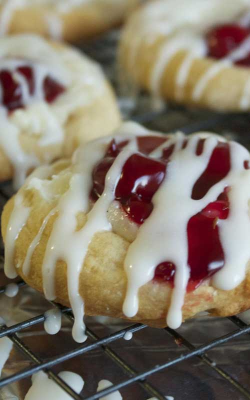 These Mini Cherry Cheese Danishes a simple, yet beautiful dessert. The crescent rolls are the perfect base for the sweet cream cheese and the tart cherries.