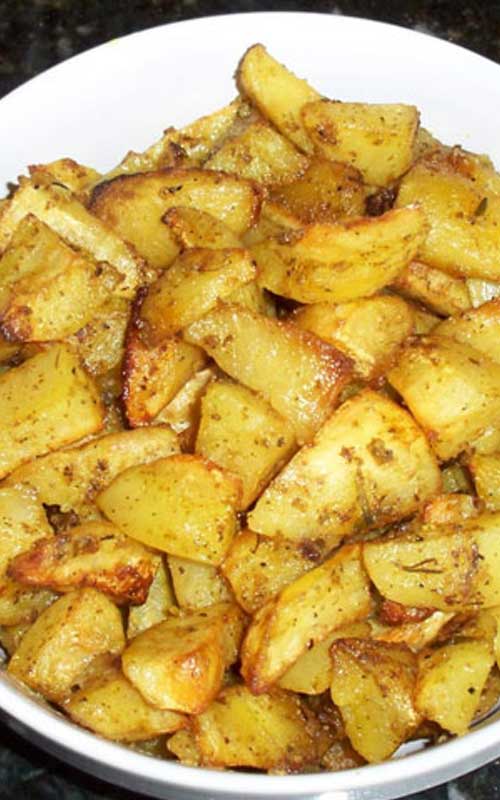 These Oven Roasted Garlic Potatoes have become a family favorite. The potatoes roast slowly in a bath of lemon and olive oil, soaking up all the garlic-y goodness!