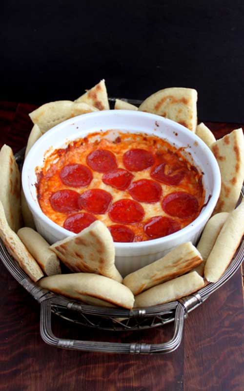 This Lazy 4-Layer Deep Dish Pizza Dip would make a great and easy addition to any party or get together. Or you could even make it as a quick after school snack!