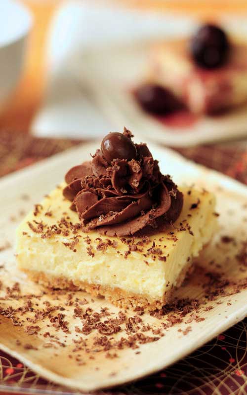 This Zabaglione Cheesecake is a rich, smooth, and delightful cheesecake combination set on an almond crumb base and glazed with a decadent trufle fudge frosting.