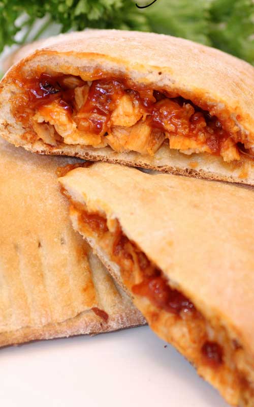 I love how quick and easy these Barbecue Chicken Calzones are and they only require a few ingredients to make the ultimate BBQ chicken sandwich.