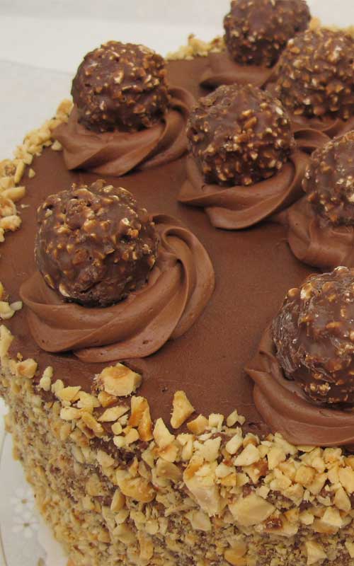This sinful 5-Layer Ferrero Rocher Nutella Dream Cake surpassed my vision! The cake was light, moist, and delicious (all must-haves!) and the “Nutella Cloud Frosting” certainly tasted like a dream! (Even as a non-frosting  eater, I found myself licking my fork!)