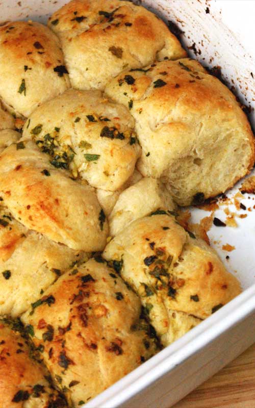 Recipe for Tear 'n' Share Pull Apart Garlic Bread - Buttery, warm, and chewy. Plus, like most baked goods, homemade is best. Better yet, it's an easy to make golden, yeasty treat!
