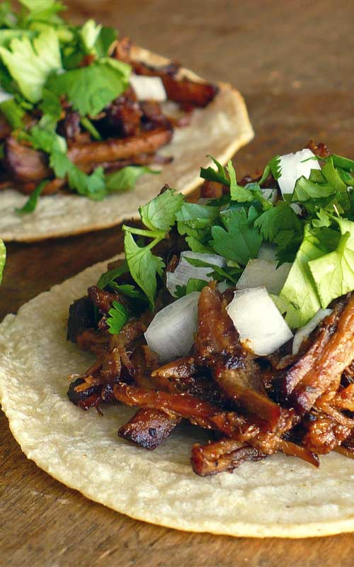 Not many things are better than a slow-roasted barbacoa recipe. While it's delicious as an entree itself, we prefer eating it as Tacos De Barbacoa.