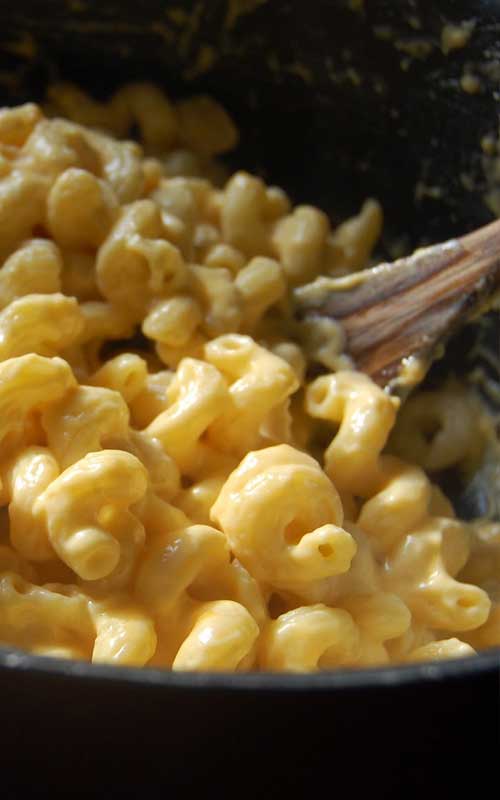 This Creamy Stovetop Macaroni and Cheese comes together very quickly, and you won’t believe how delicious it is. This recipe for macaroni and cheese tastes even better than a version made with Velveeta, and it’s every bit as creamy.