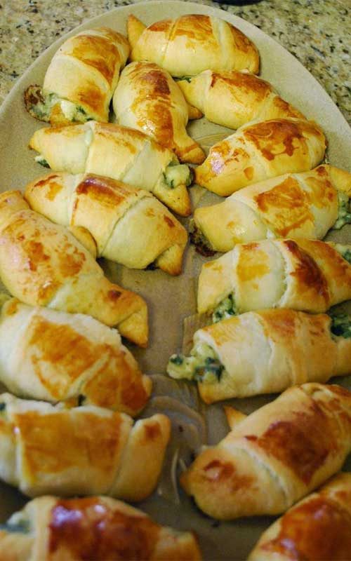 These Windy City Crescent Rolls are simple to make and super yummy. Served warm and gooey and stuffed with feta and spinach, it's hard to eat just one!