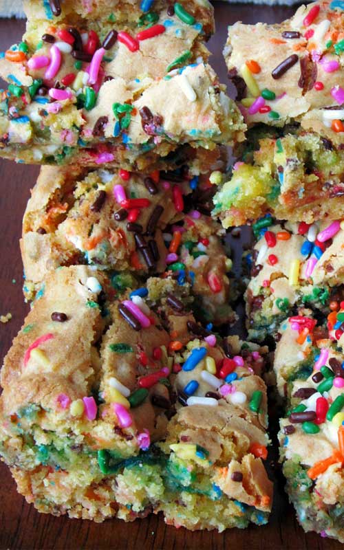 If you make these Cake Batter Blondies, you will probably make them again two nights later.  I seriously could not stop eating these suckers. I wish you the best, I can't control what happens to your waistline.