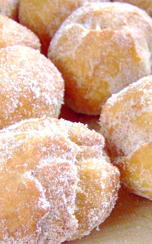 Hawaiian Doughnuts  (or Malasadas) are one of the all time favorite snacks. If you make these, prepare to rapidly become more popular with all of your friends.