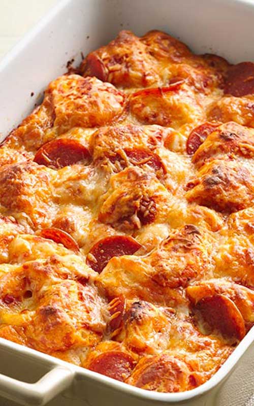 You won't believe how quickly this pan pizza goes together! And if there's ever a meal that everyone in the family can agree upon, it's this Easy Pizza Bake.