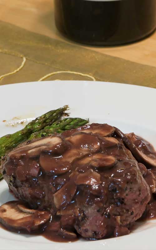 Recipe for Pepper Steak with Port Wine Mushroom Sauce - Slather pan-seared beef fillets with a homemade port-wine mushroom sauce for a easy but elegant entrée.