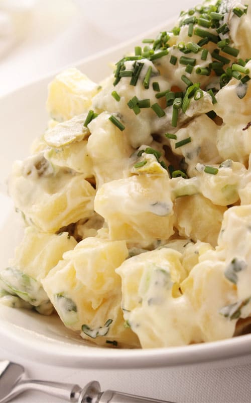 Recipe for Classic Potato Salad with Chives - A super simple salad that is always a hit at parties. The fresh chopped chives add a pop of color and delicious flavor. You can even add crushed garlic or finely chopped onion to take it up another notch!