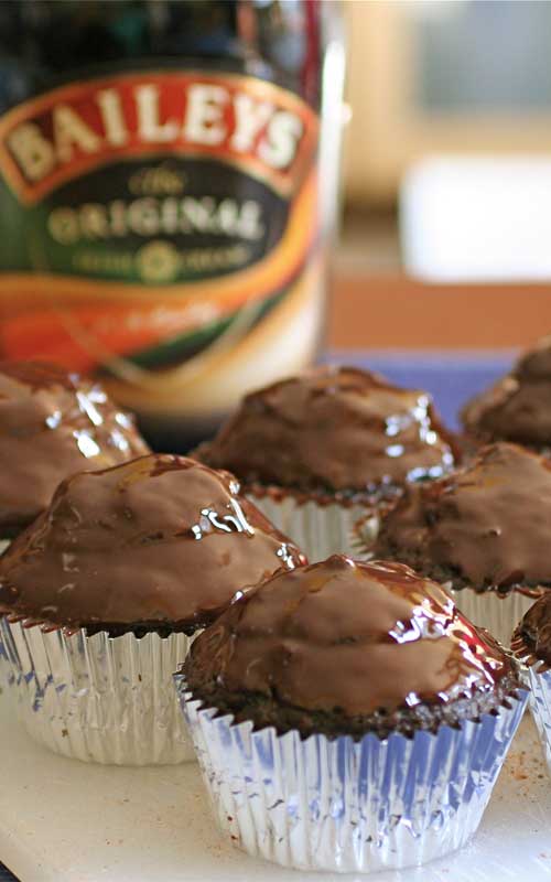 Recipe for Irish Coffee Cupcakes with Chocolate Ganache - These Irish Coffee Cupcakes may take a bit more work than some other recipes out there...but look at that chocolate ganache! And then you have the surprise Irish cream filling inside of them! That bit of extra effort is soo worth it!